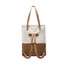 A beige and brown convertible canvas backpack with leather straps, featuring a simple design and a logo.
