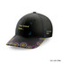 A black five-panel cap with a patterned brim and branding areas. Features a vibrant design along the edge.
