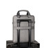 A grey business sling laptop bag with a handle and trolley strap, resting on top of two dark suitcases.