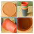 A set of four 320ML wheat straw toothbrush cups in orange, green, and blue with a textured ribbed design. One cup's interior is visible.