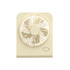 A mini desk fan in cream colour features a circular grille and a single button for operation.