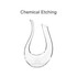 A U-shaped clear glass wine decanter with an elegant, curved design and two spouts. It features a logo.