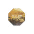 An octagonal frosted metal coaster in yellow with textured patterns and a logo.