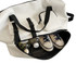 A white travel weekender bag with black straps, featuring sneakers and drink bottles inside. It has a pocket on the side.