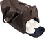 A brown polyurethane duffle bag with a zippered opening, revealing white shoes inside. It has handles and a logo.
