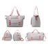 A grey foldable sports duffle bag with pink straps, featuring multiple angles and a front pocket.