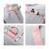A grey foldable sports duffle bag with pink accents, featuring a pocket holding a smartphone and zippers.