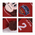 A plush toy monkey wearing a red basketball jersey with a logo and the number 2 on it.