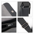 A polyurethane shoulder bag in grey and black, featuring a zipper, snap closure, and an adjustable strap.