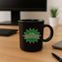 A black ceramic coffee mug with a vibrant green and yellow graphic featuring the words "Feeling GOOD".
