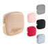 A stylish mini makeup bag in beige with gold detailing, alongside options in pink, grey, black, and red.