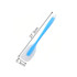 A silicone spatula with a blue handle and a white spatula head, measuring 27.3 cm by 5.3 cm.