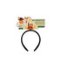 A black foam topper headband featuring a festive Oktoberfest design with character and food illustrations.