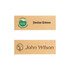 A wooden name badge in light brown with two engraved names and a logo, featuring a simple design.