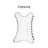 A transparent Gua Sha tool with a smooth surface and small beads on one edge, featuring a logo.