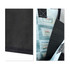 A small tote bag in black with a patterned interior and a logo, showcasing a textured surface.