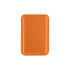 An orange PU magnetic phone card holder with a smooth finish and a stitched border. It features a logo.