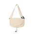 A cream-coloured casual crossbody bag with a flap closure and an adjustable strap, featuring a logo.