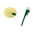A green pipe wrench-shaped ballpoint pen rests next to a yellow notepad with handwritten notes.
