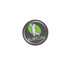 A circular resin-coated label featuring a logo in green and white on a dark background, with branding details.