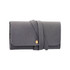 A grey synthetic leather jewellery bag with a fold-over design and a decorative strap closure.