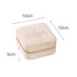 A velvet jewellery organiser in ivory, measuring 10cm x 10cm x 5cm, with a zip closure and a subtle logo.