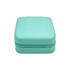 A turquoise PU leather jewellery box with a zippered closure and a textured finish. It features a logo on the surface.