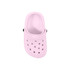 A pink clog shoe-shaped charm with ventilation holes and decorative buttons. It features a simple design and has a smooth finish.