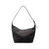 A dark grey canvas tote bag with a single brown leather strap and a minimalist design. Features a logo.