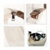 A beige canvas tote bag with brown accents, showcasing a zipper, strap detail, and interior contents including headphones and bottles.