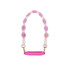 A drink bottle strap featuring woven pink and white flowers with yellow centres, complemented by a pink silicone grip.