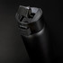 A drink bottle in matte black with a secure lid and a built-in sipping spout, featuring a logo.