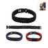 A paracord bracelet in black, red, and blue with a black metal plate and a logo. Includes adjustable clasps.