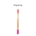 A bamboo toothbrush with a small round handle, featuring a pink brushing head and a logo.