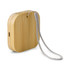 A bamboo wireless charger with a silver strap, featuring a sleek, rounded design and a charging port.