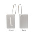 A brushed aluminium luggage tag featuring a plane design, with a dual-sided layout and attached through a metal loop.