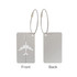 A silver luggage tag with an airplane design on one side and a plain back, featuring a wire cable attachment.