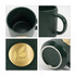A green ceramic mug with a ribbed texture and a bronze medal at the front. It has a sturdy handle and an inner finish.