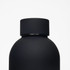 A drink bottle in matte black with a rounded body and a smooth cap. It features a logo on the surface.