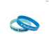 Two silicone wristbands in blue and light blue, featuring different phrases and a logo on each band.