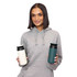 A drink bottle in white and teal, featuring a logo, held by a person in a grey hoodie.