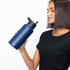 A drink bottle in navy blue, featuring a double wall design and three lids, held by a person.