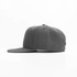 A grey cap with a flat brim, featuring a logo on the side and a textured fabric.