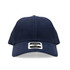 A navy blue cap featuring a branded label on the front.