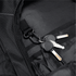 A black backpack interior featuring a hook and a set of keys attached inside.