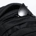 A black backpack featuring multiple zippered pockets and a pair of black sunglasses resting in one of the pockets.