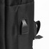 A close-up of a black Blackburn Backpack featuring a textured tab and side pocket. The backpack has a logo on it.