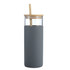 A drink bottle in grey with a bamboo lid and a straw, featuring a transparent glass body.