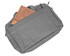 A grey laptop bag with a large front pocket containing a brown notebook. The bag has a sleek design and visible branding.