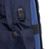 A navy backpack featuring a black zipper pull and a side attachment point. It has a textured fabric design.